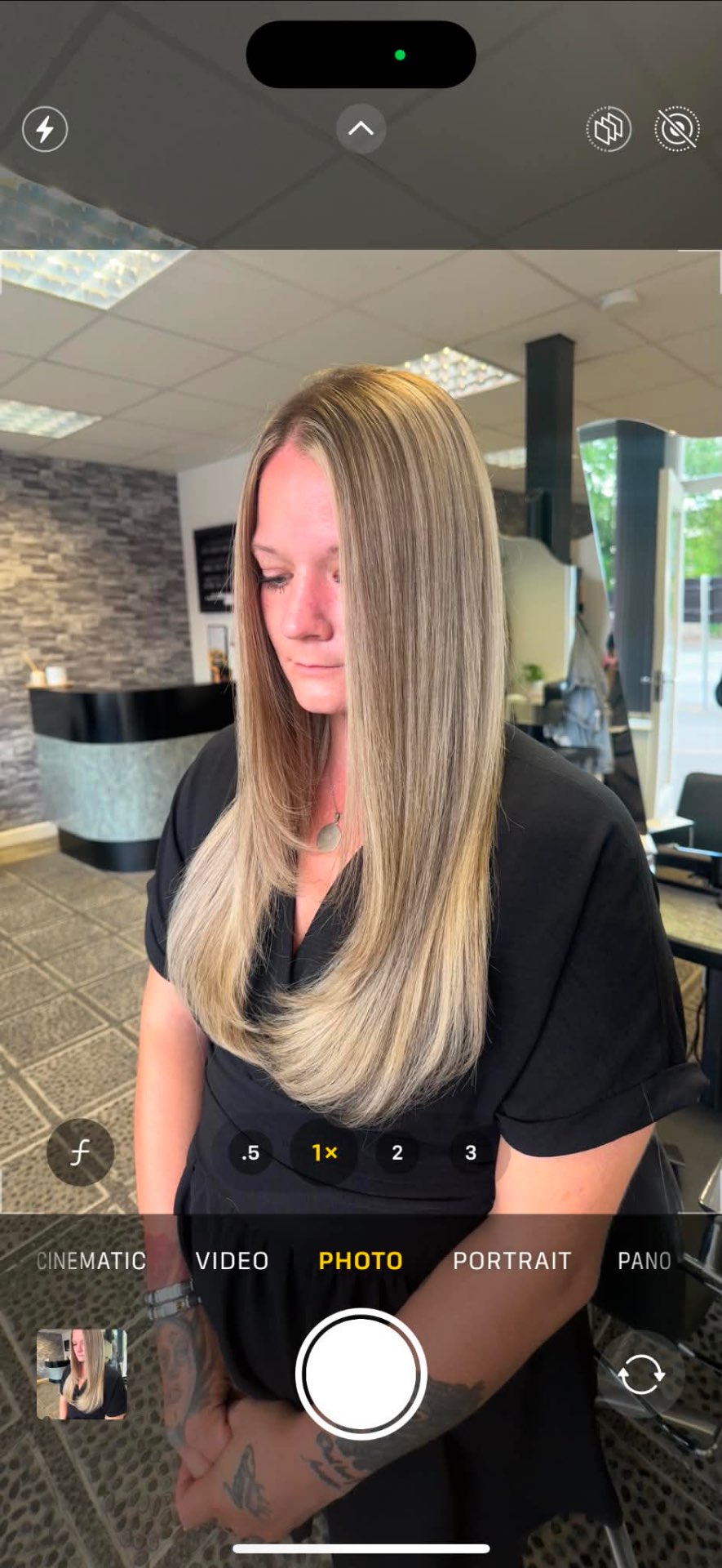 Long blonde balayage finished poker straight, side view